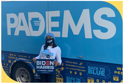 Ny'Asia stands in front of PADEMS bus as a digital organizer on Joe Biden's campaign