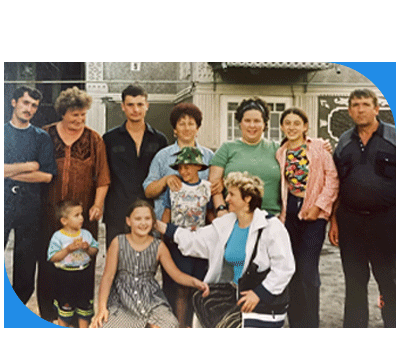 Julia (third from right in the top row) with her family in Moldova.