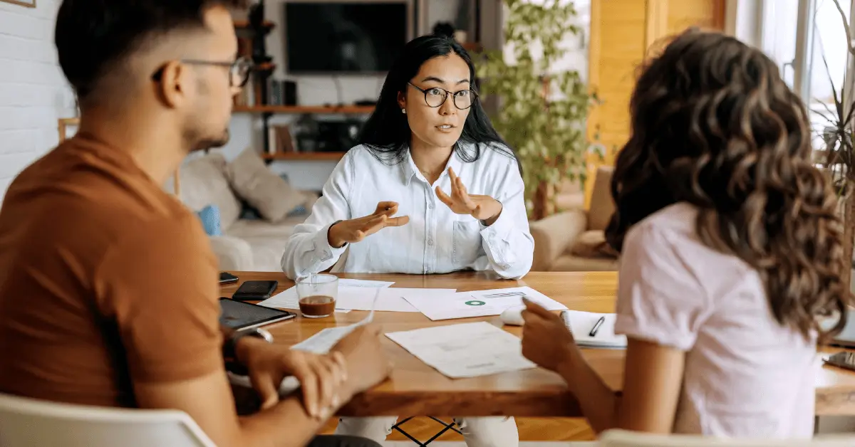 A campaign team discusses their political campaign plan at a table.